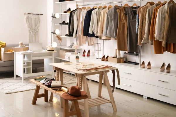 Stylish interior of modern store with clothes and accessories