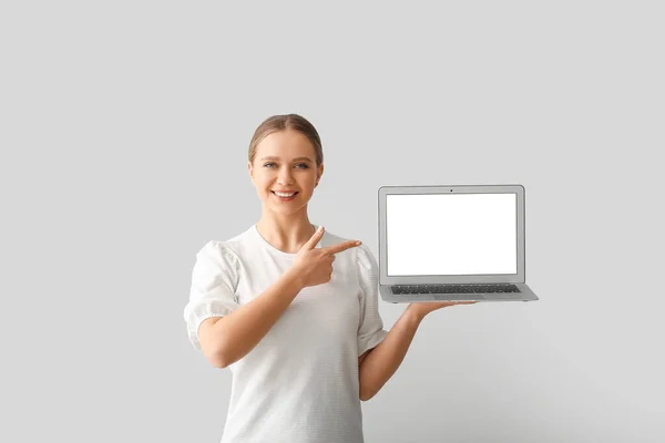 Beautiful Young Woman Holding Laptop Blank Screen Grey Background — Stock Photo, Image