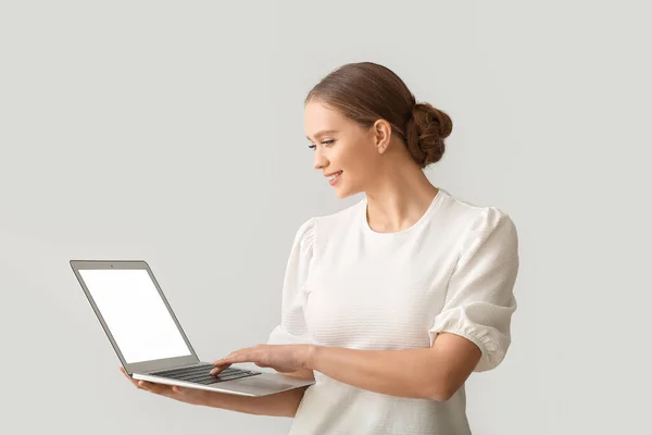 Beautiful Young Woman Holding Laptop Blank Screen Grey Background — Stock Photo, Image