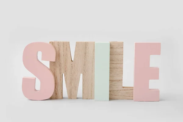 Stylish Decor Shape Word Smile Light Background — Stock Photo, Image