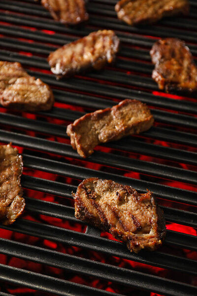 Tasty beef brisket on barbecue grill