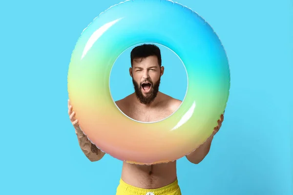 Emotional Young Man Inflatable Ring Color Background — Stock Photo, Image