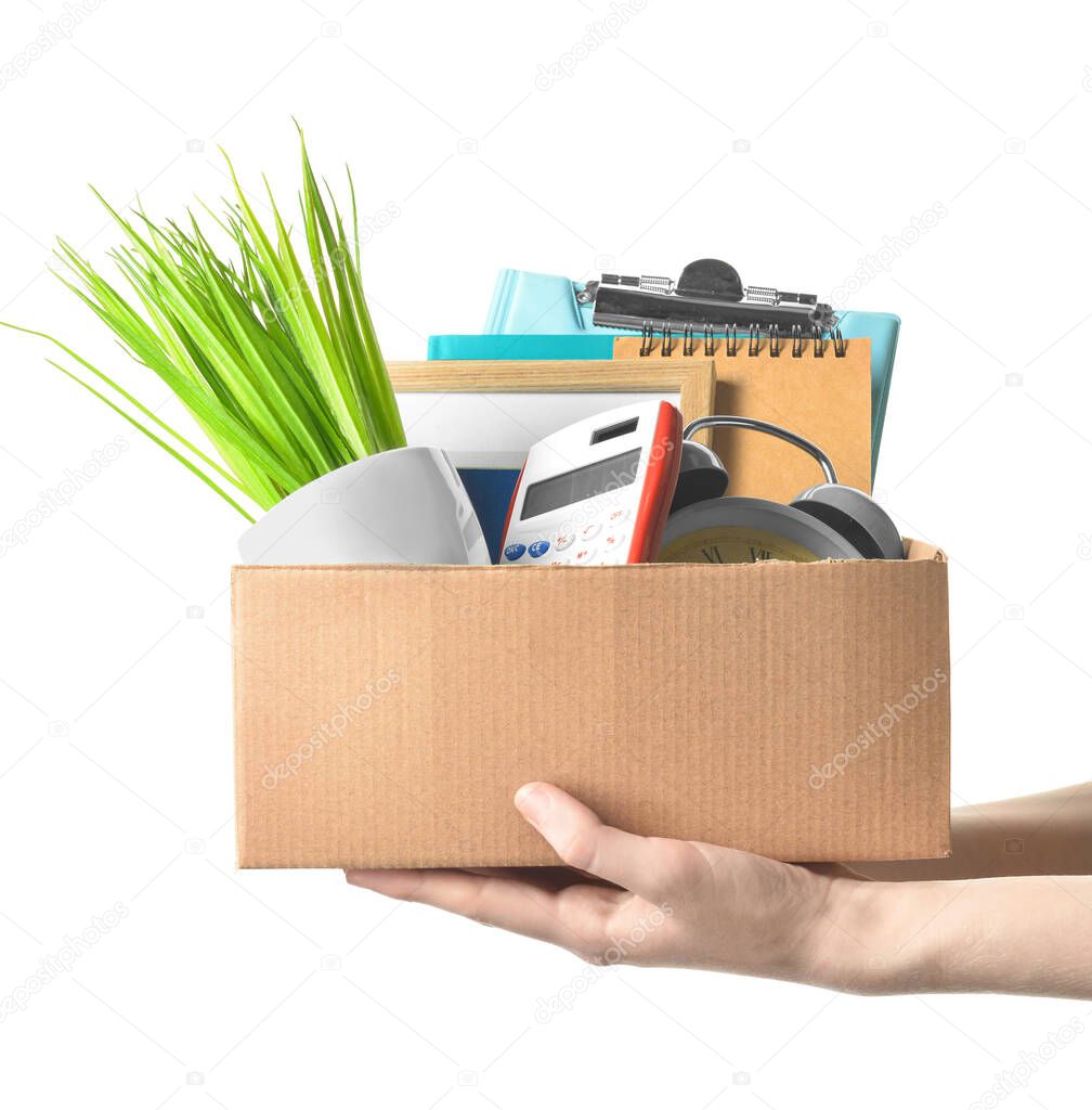 Woman holding cardboard box with personal stuff on white background