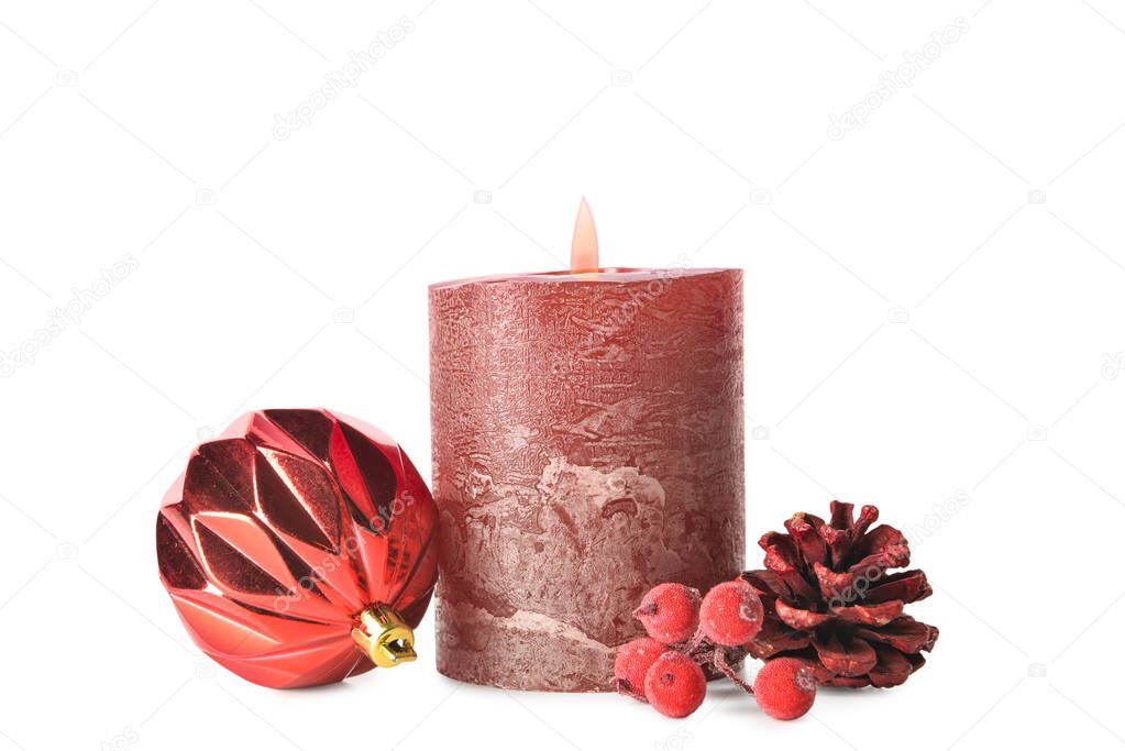 Christmas composition with candles, pine cone and ashberries on white background