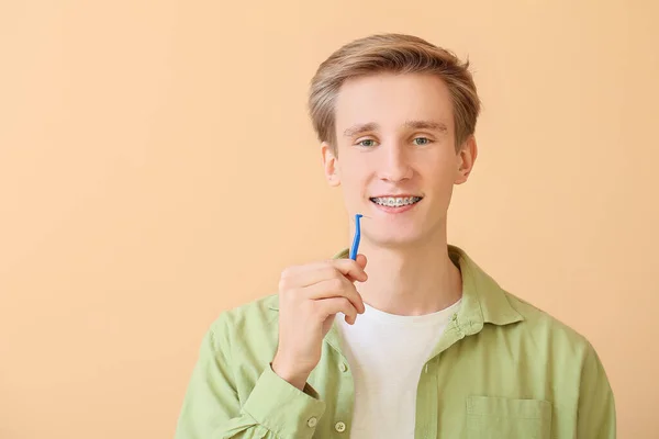 Handsome Man Dental Braces Brush Color Background — Stock Photo, Image