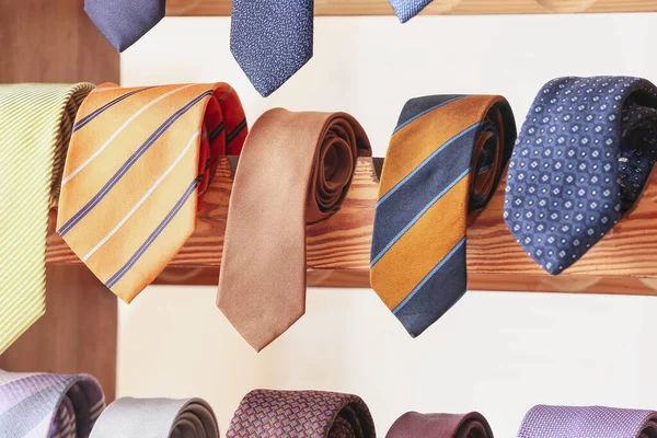 Wooden Stand Different Stylish Neckties Closeup — Stock Photo, Image