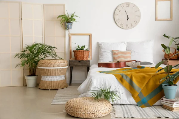 Interior of stylish bedroom with plants