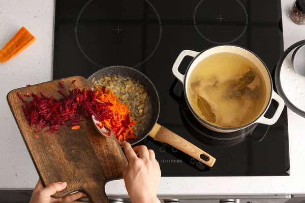 Woman Putting Grated Carrots Beetroot Frying Pan Kitchen — Stock Photo, Image