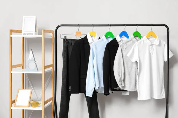 Rack Stylish School Uniform Light Wall — Stock Photo, Image