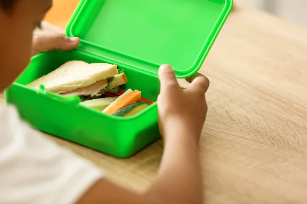 Cute little child having lunch at school, closeup