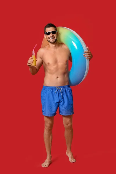 Young Man Inflatable Ring Juice Color Background — Stock Photo, Image