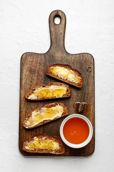 Wooden Board Tasty Toasted Bread Honey White Background — Stock Photo, Image