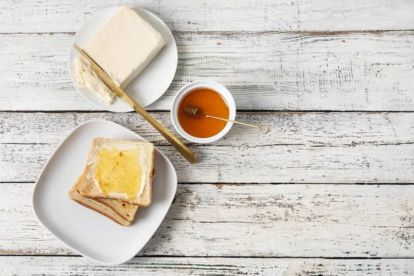 Plate Tasty Toasted Bread Honey Butter White Wooden Background — Stock Photo, Image