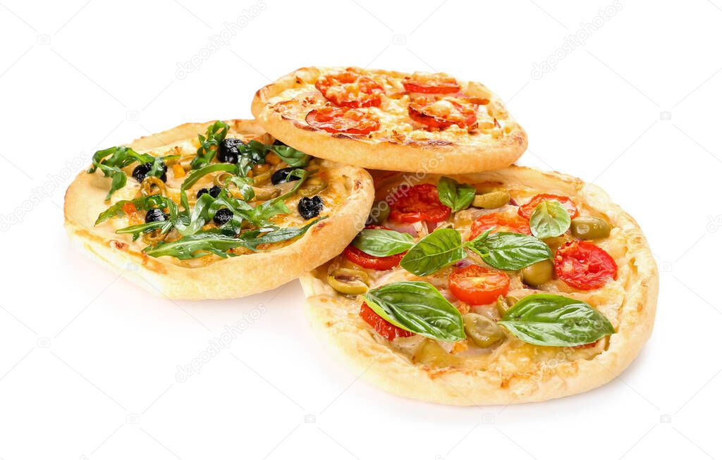 Tasty mini pizzas on white background