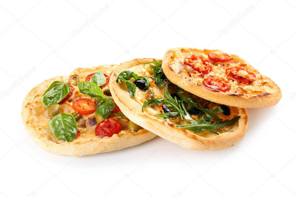 Tasty mini pizzas on white background
