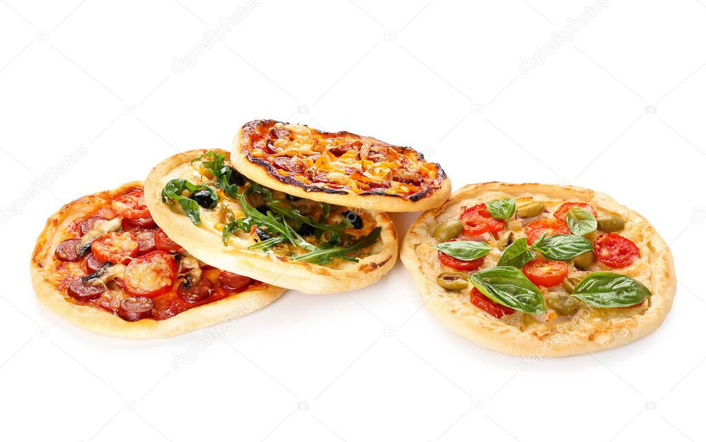 Tasty mini pizzas on white background