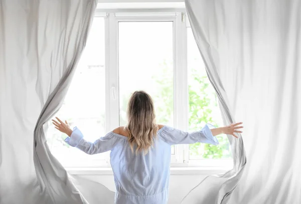 Woman Opening Light Curtains Modern Room — Stock Photo, Image