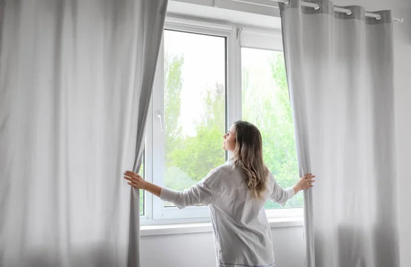 Woman Opening Light Curtains Modern Room — Stock Photo, Image