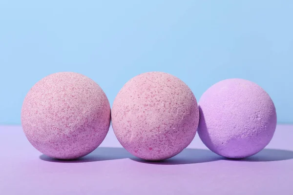 Lavender bath bombs on color background