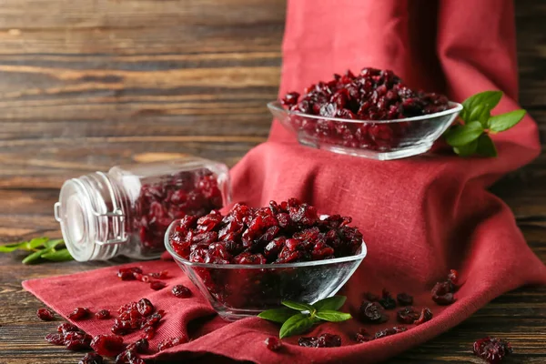 Bowls Tasty Dried Cranberries Wooden Background Closeup — Stock Photo, Image