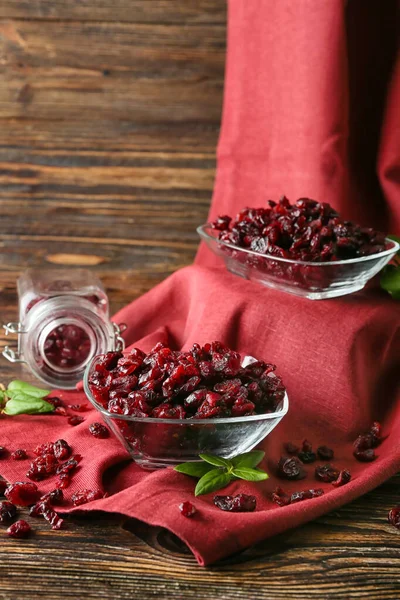 Bowls Tasty Dried Cranberries Wooden Background — Stock Photo, Image