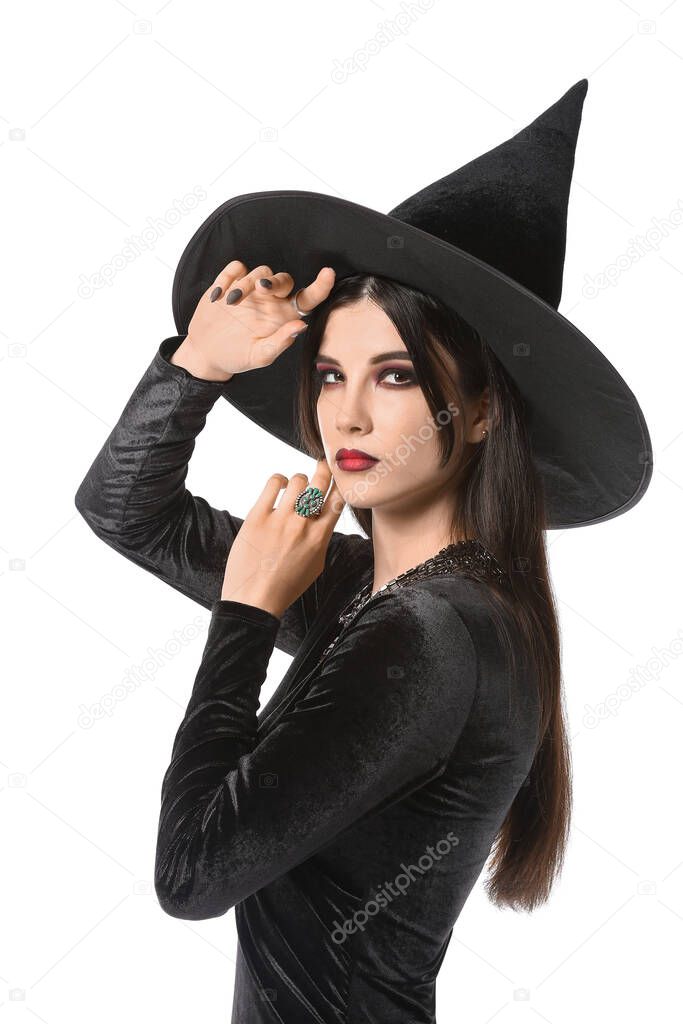 Beautiful woman dressed as witch for Halloween party on white background