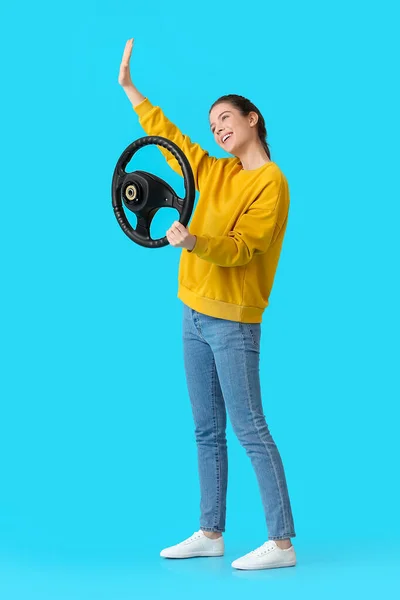 Young Woman Steering Wheel Waving Hand Color Background — Stock Photo, Image