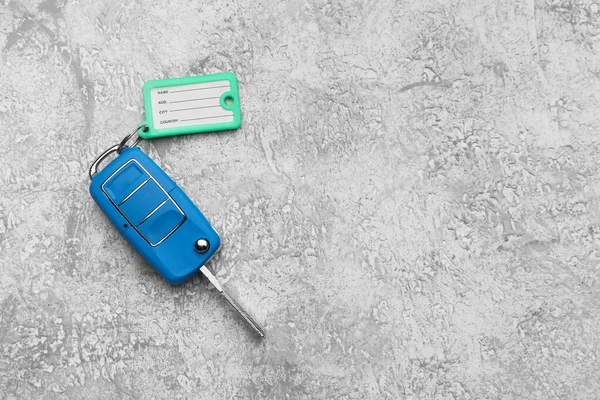 Blue Car Key Plastic Tag Grunge Background — Stock Photo, Image