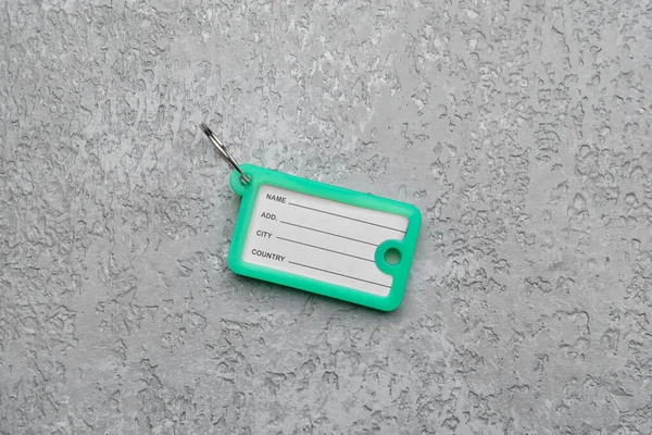 Plastic Key Tag Grey Background — Stock Photo, Image