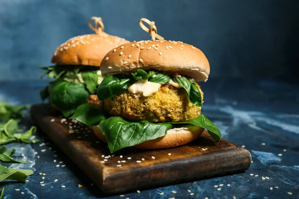 Wooden Board Tasty Vegetarian Burgers Blue Background — Stock Photo, Image