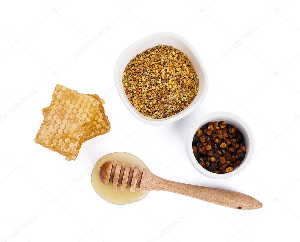 Honey combs and bee products on white background