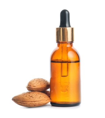 Beyaz arka planda bir şişe sağlıklı ve gerekli yağ