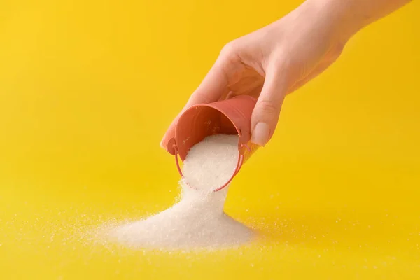 Woman Sprinkling Sugar Bucket Color Background — Stock Photo, Image