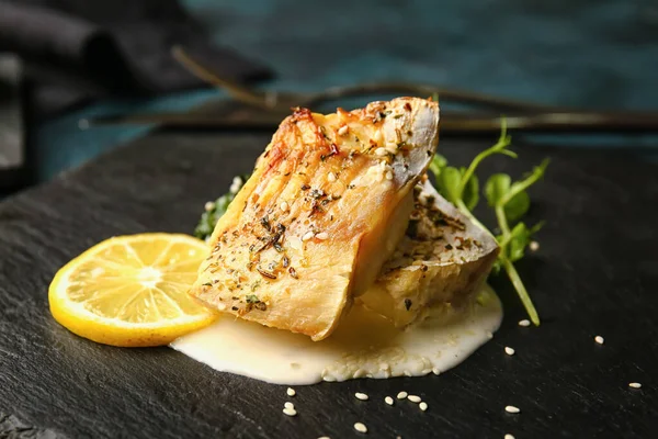 Board Tasty Baked Cod Fillet Sauce Lemon Dark Background Closeup — Stock Photo, Image