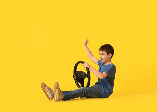 Little Boy Steering Wheel Color Background — Stock Photo, Image