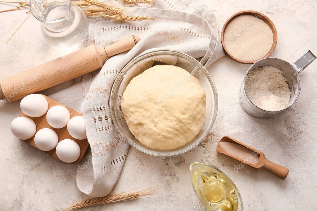 Composition with fresh dough on light background