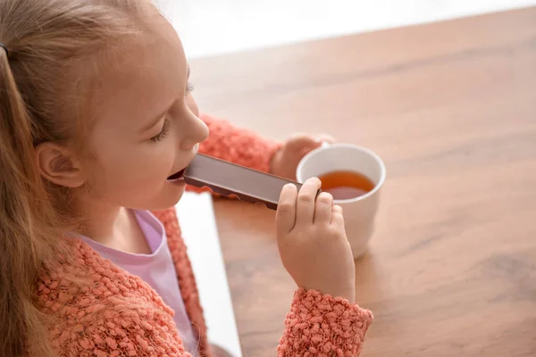 Cute Little Girl Eating Chocolate Home Closeup — Stock Photo, Image