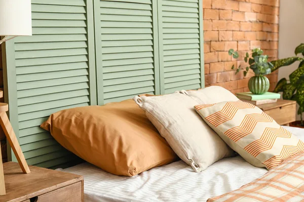 Comfortable bed near folding screen