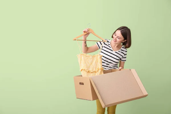 Young Woman Wardrobe Box Clothes Color Background — Stock Photo, Image