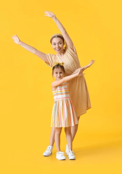 Dancing Young Woman Her Little Daughter Color Background — Stock Photo, Image