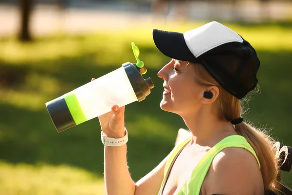 Sporty Mature Woman Drinking Water Outdoors — Stock Photo, Image