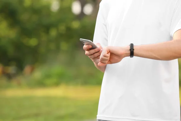 Sporty Male Runner Checking Pulse Outdoors — Stock Photo, Image