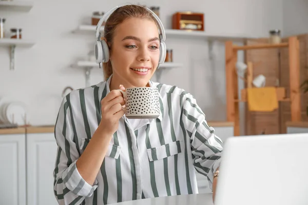 Young Woman Drinking Tea While Video Chatting Kitchen — Stock Photo, Image