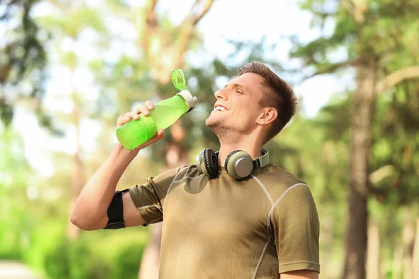 Sporty Young Man Drinking Water Jogging Park — Stock Photo, Image