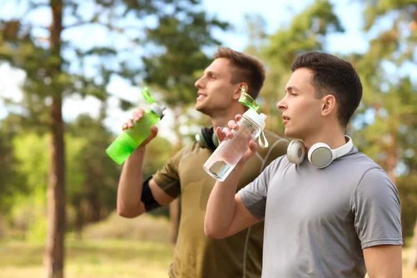 Sporty Young Men Drinking Water Park — Stock Photo, Image