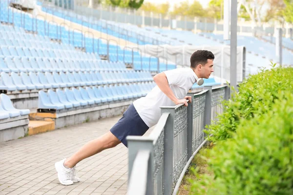 Sporty Young Man Doing Push Ups Stadium — Stock Photo, Image