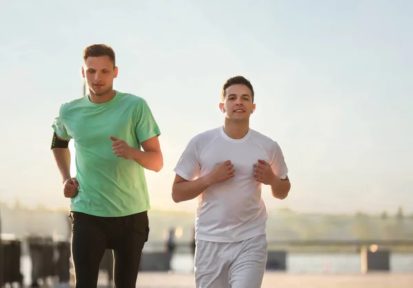 Sporty Young Men Running Outdoors — Stock Photo, Image