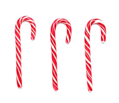 Beyaz arka planda lezzetli baston şekerler