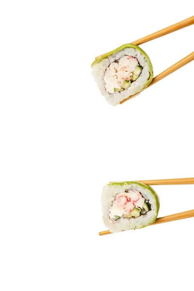 Chopsticks Tomando Deliciosos Rolos Sushi Com Abacate Fundo Branco — Fotografia de Stock