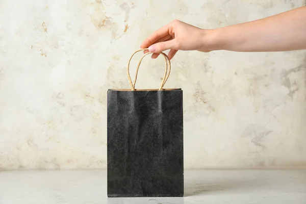 Female Hand Shopping Bag Light Background Black Friday Sale — Stock Photo, Image